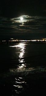 Scenic view of sea against sky at night