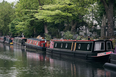 View of boats moored in river