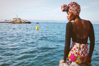 Portrait of woman standing in water