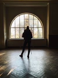 Woman walking in tunnel