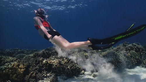 Woman swimming in sea