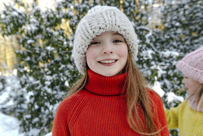 Portrait of a smiling girl in snow