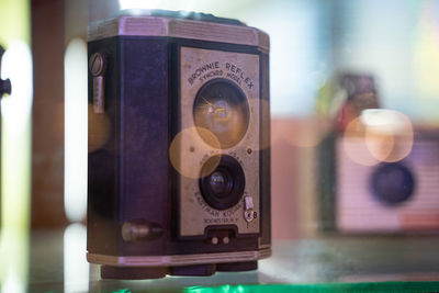 Close-up of telephone booth on table