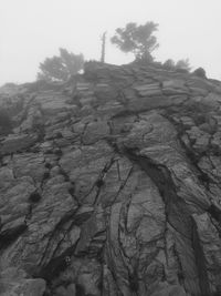 Low angle view of rock formation against sky