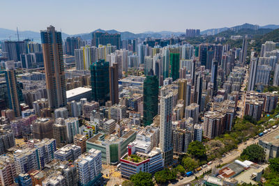 Aerial view of modern buildings in city against sky