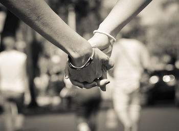 Close-up of couple holding hands