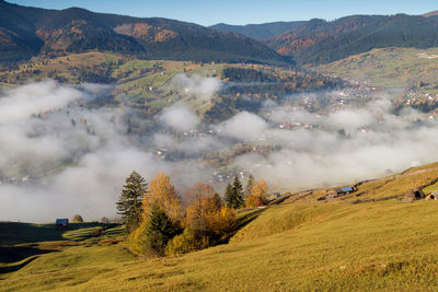 Scenic view of landscape against sky during autumn