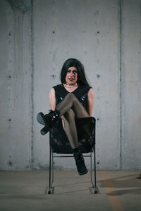 Portrait of woman sitting on chair