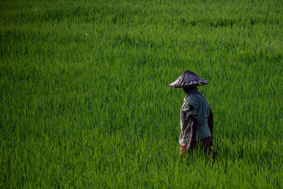 Full length of man working on field