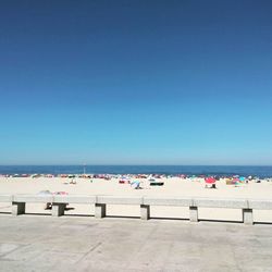 View of calm sea against clear blue sky