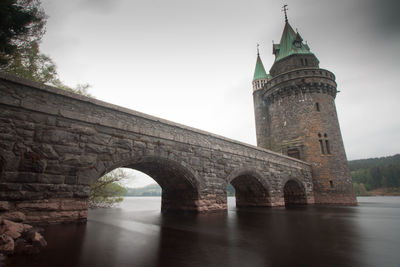 View of bridge over river against sky