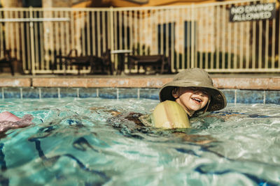 Portrait of man swimming in pool