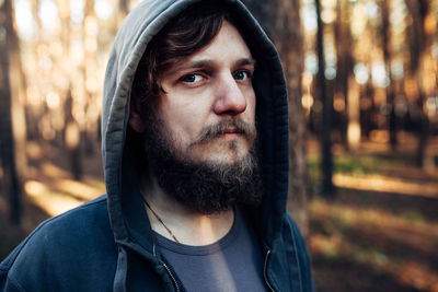 Portrait of young man in forest