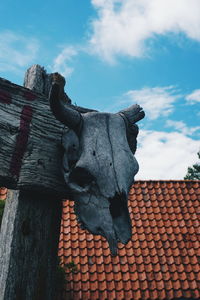 Low angle view of broken horned against sky