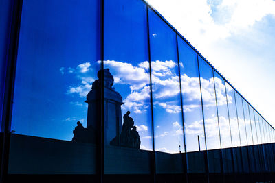 Low angle view of bridge against cloudy sky