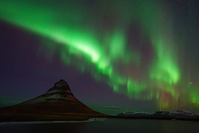 Low angle view of illuminated light trails at night