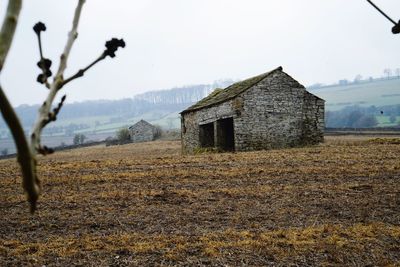 House on field against sky