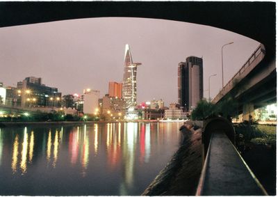 Illuminated cityscape against sky