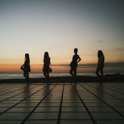 Silhouette of woman at sunset