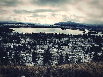Scenic view of mountains against cloudy sky