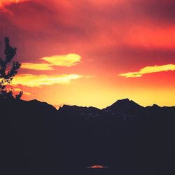 Scenic view of dramatic sky over mountains