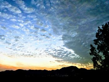 Low angle view of silhouette landscape against sky during sunset