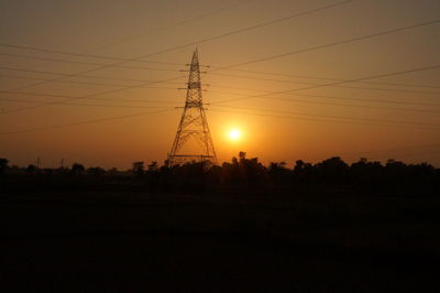 Silhouette landscape against sky during sunset