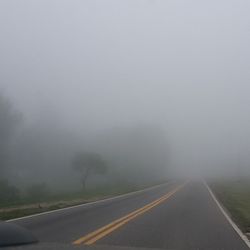 Empty road in foggy weather