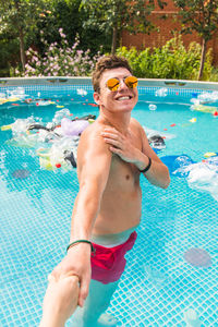 Man swimming in pool