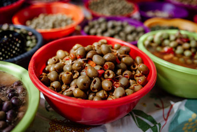 High angle view of olives in bowl at market stall