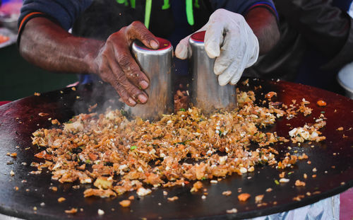 Midsection of man preparing food