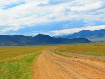 Road passing through field