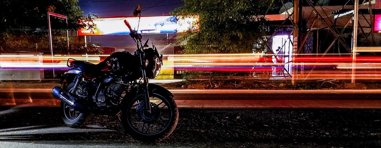 transportation, mode of transportation, land vehicle, street, city, road, motion, blurred motion, illuminated, speed, light trail, long exposure, travel, motorcycle, night, on the move, motor vehicle, real people, nature, outdoors, riding