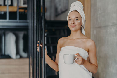 Portrait of a woman holding ice cream