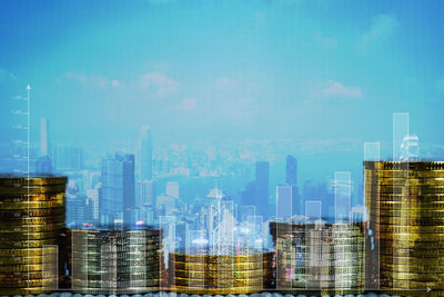 Digital composite image of modern buildings against sky