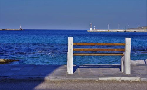 Scenic view of sea against clear blue sky