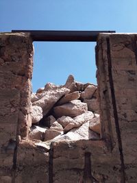 Low angle view of built structure against blue sky