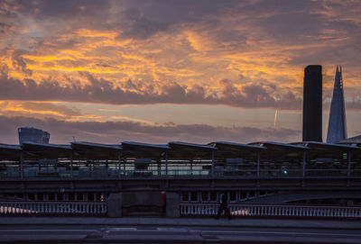 Bridge over sea at sunset