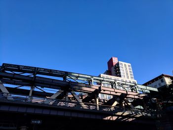 Low angle view of built structure against clear blue sky