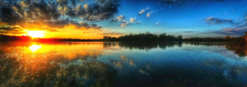 Scenic view of lake at sunset