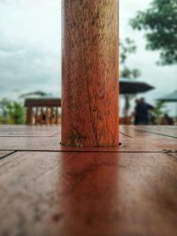 Close-up of wooden post on table