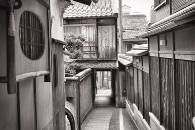 Empty alley amidst buildings in city
