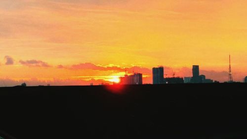 Silhouette of buildings at sunset