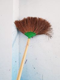 High angle view of broom on wall