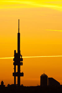 Silhouette of building against sky during sunset