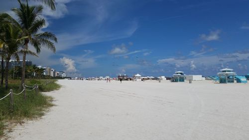 Scenic view of beach against blue sky