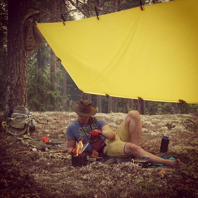 leisure activity, lifestyles, sitting, men, relaxation, full length, person, casual clothing, rear view, field, umbrella, childhood, day, chair, tent, outdoors, nature