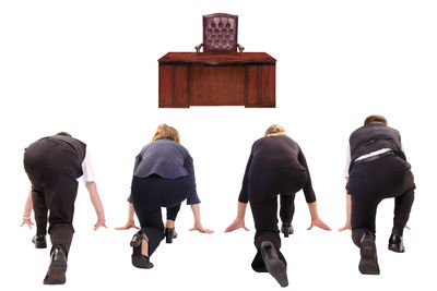 Rear view of people standing against white background