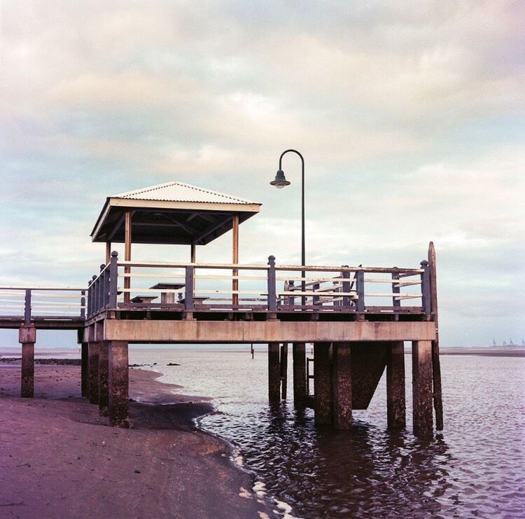 sky, cloud - sky, water, sea, nature, tranquility, day, built structure, outdoors, no people, architecture, beach, beauty in nature, horizon over water, animal themes