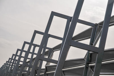 Low angle view of metal structure against sky